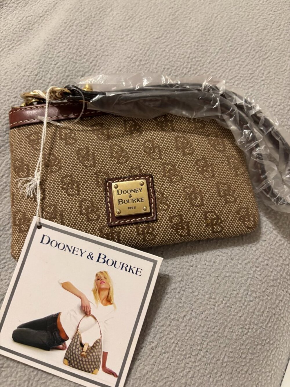 Dooney and Bourke zip credit card/money wallet.